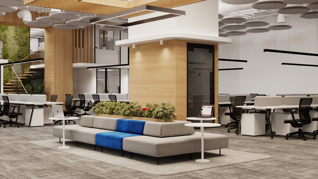 Modern office lounge area with neutral tones and soft seating designed for collaboration and employee experience.