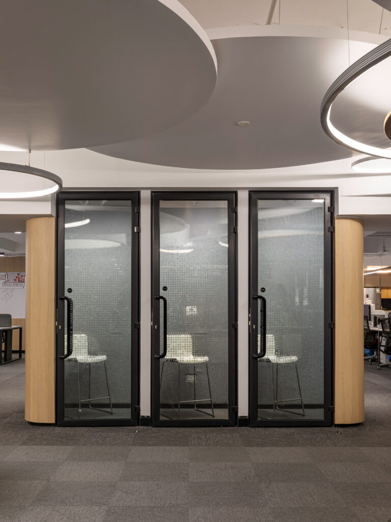 Flexible workplace spaces including phone booths, and focus rooms.